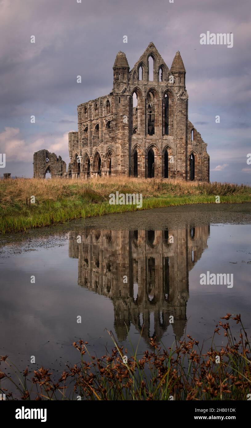 Whitby Abbey (CofE, originally founded 657, now the 13th-century church of a Benedictine Abbey) and reflection, Whitby, Yorkshire, UK Stock Photo