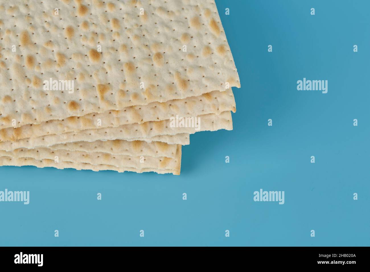 Religious matzah on the Jewish holiday of Passover, on a blue background Stock Photo