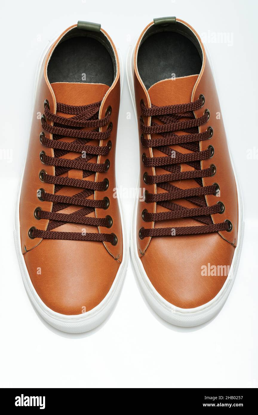 Brown leather sneakers shoes above top view isolated Stock Photo