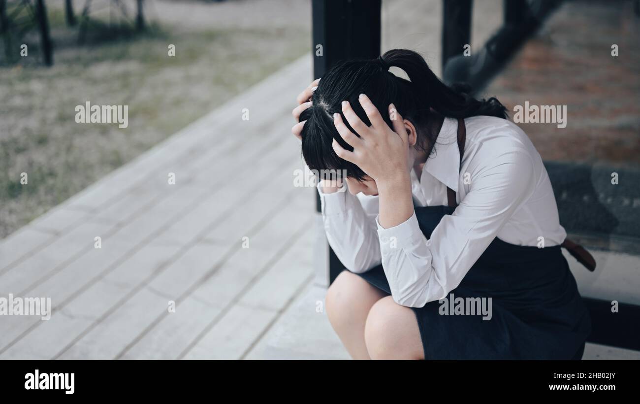 Young female small business owners feeling stress or depress because of economic conditions. Stock Photo