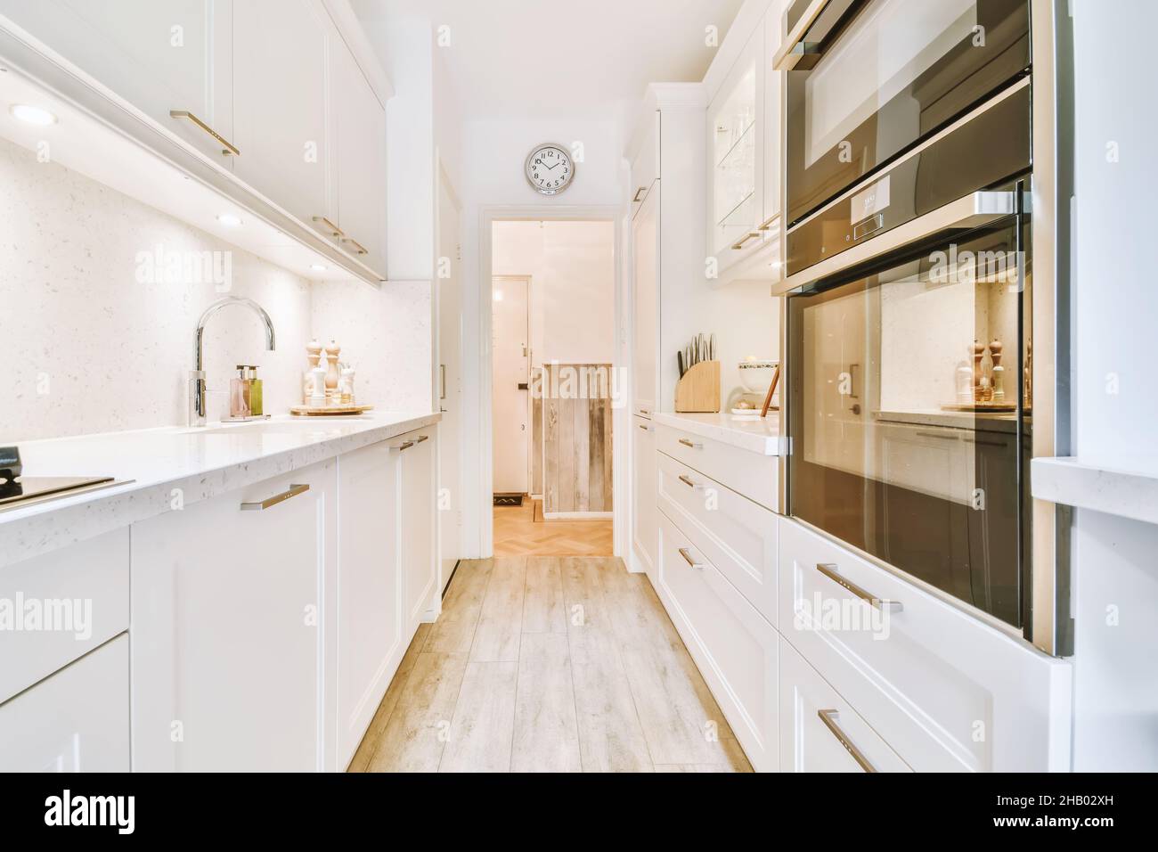 Long narrow kitchen with kitchen units on both sides Stock Photo Alamy
