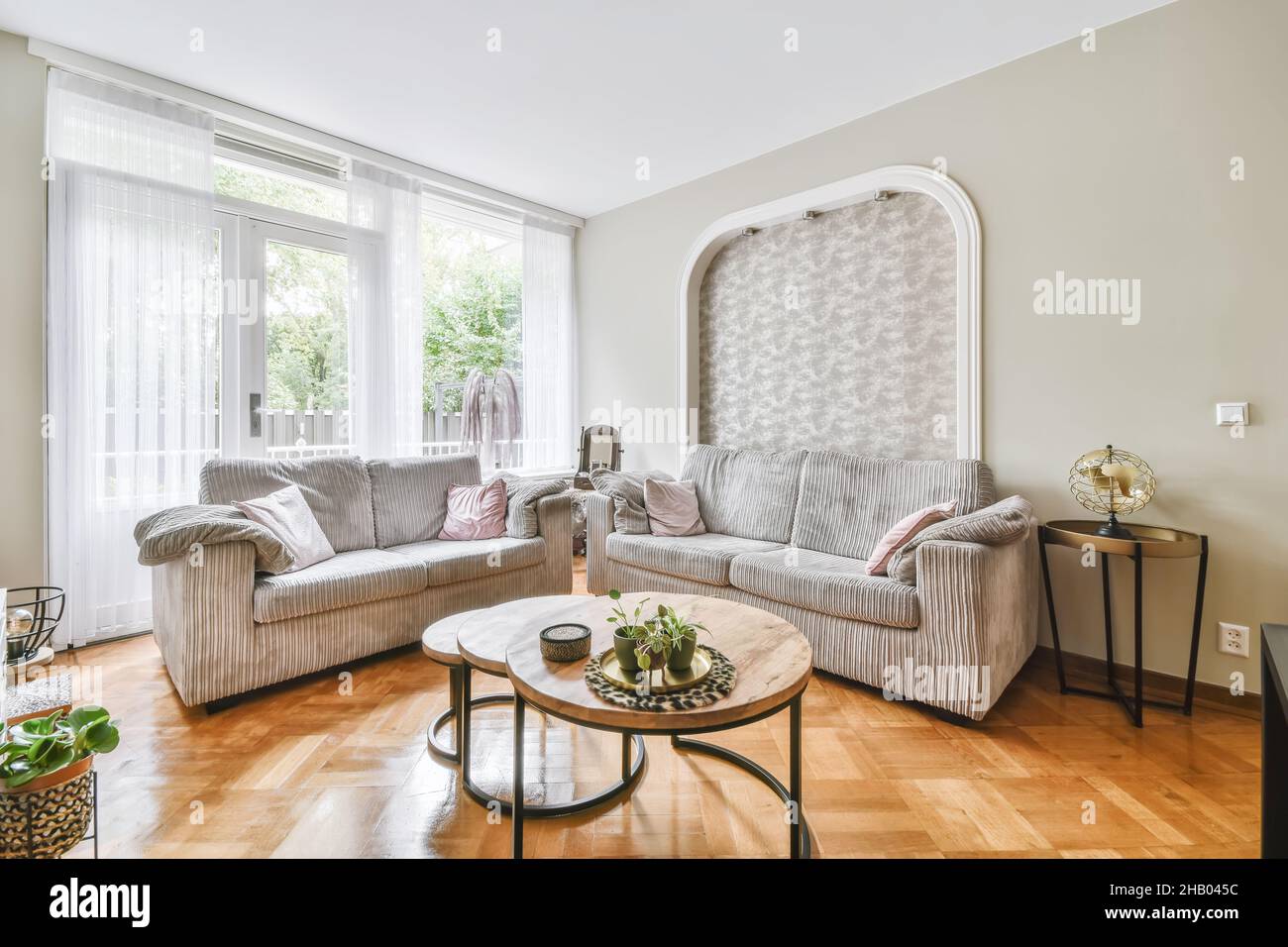 Amazing living room with gray sofas and round coffee table Stock Photo