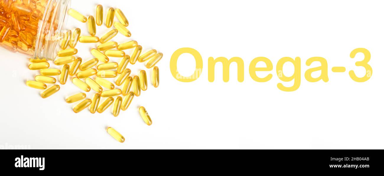 Fish oil in gelatin capsules isolate. Omega vitamins in golden colored