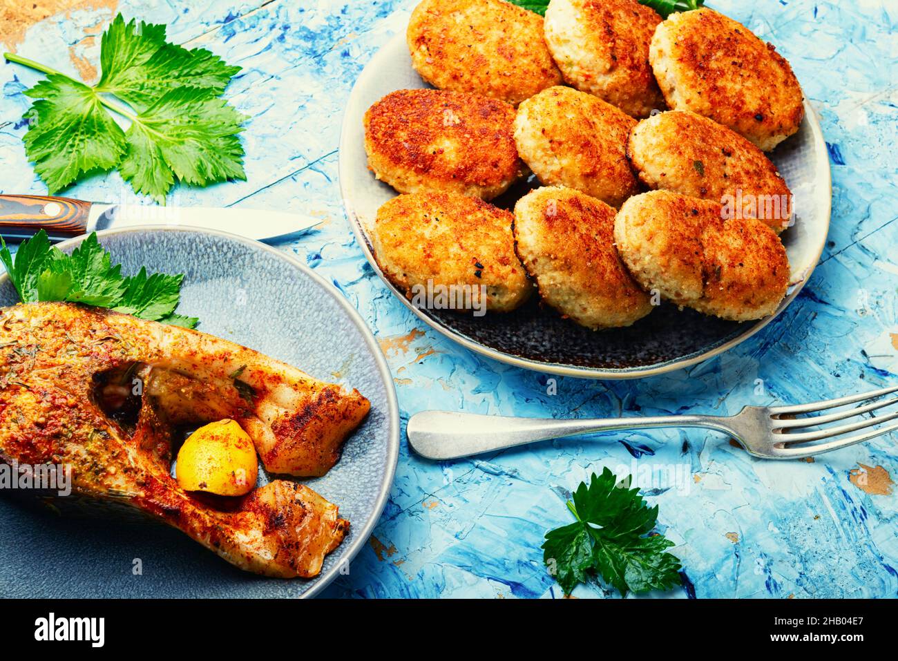 Homemade minced fish cutlets and fish steak Stock Photo