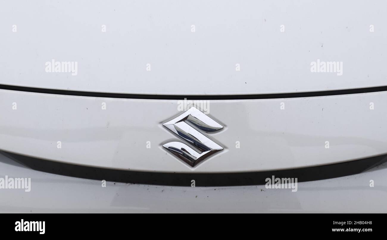KIEL, GERMANY - Nov 13, 2021: A closeup shot of the front of white Suzuki car with view of company logo Stock Photo