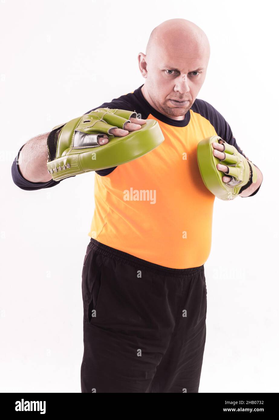 Martial arts trainer holding focus mitts Stock Photo Alamy