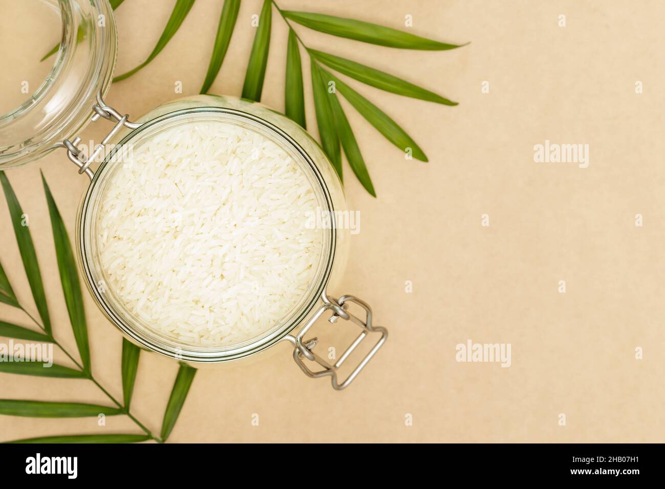 Rice. Eco friendly food composition with rice grain in a glass bowl and ...