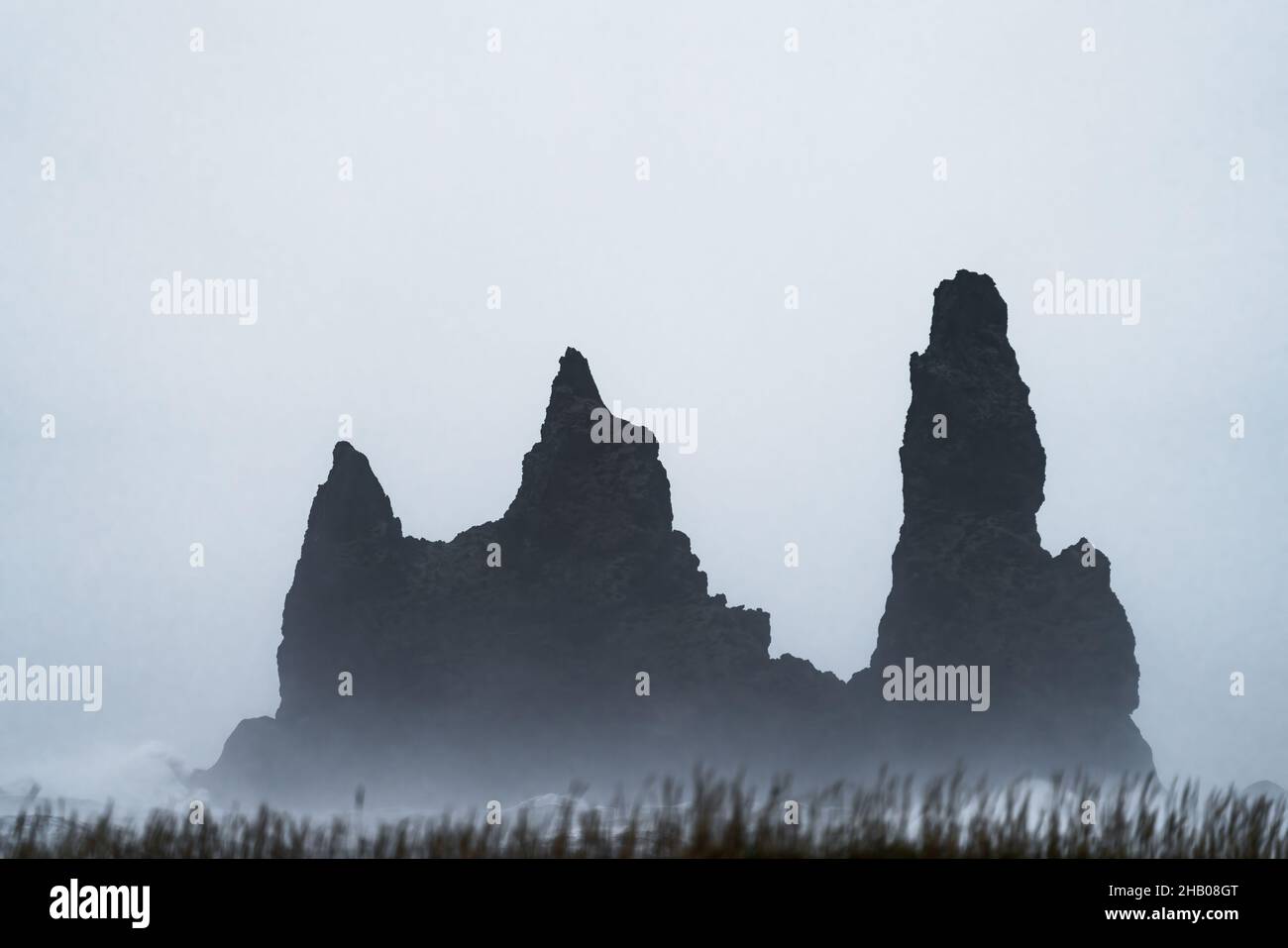 Basalt rock formations trolls silhouette under the storm Stock Photo