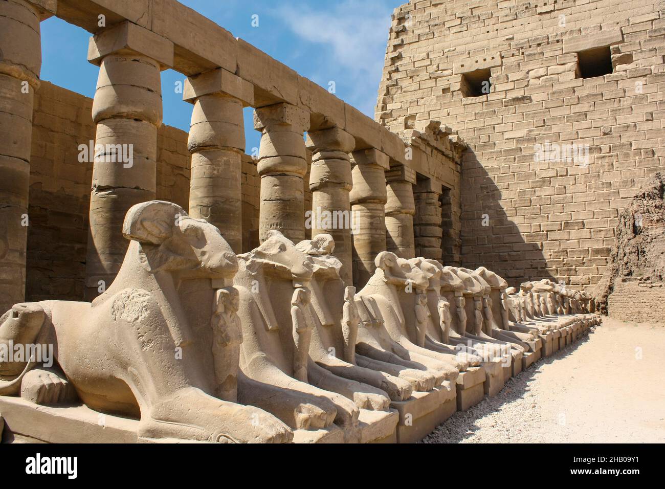 Karnak temple complex in Luxor, Egypt. Criosphinxes alley, guard sphinxes with the ram heads. Stock Photo