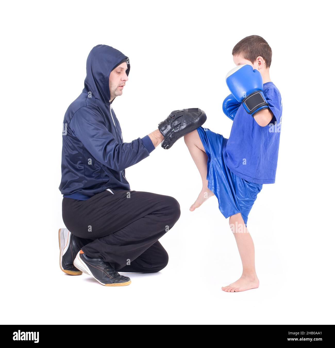 Kickboxing kids with instructor. Isolated on a white background. Studio shot Stock Photo