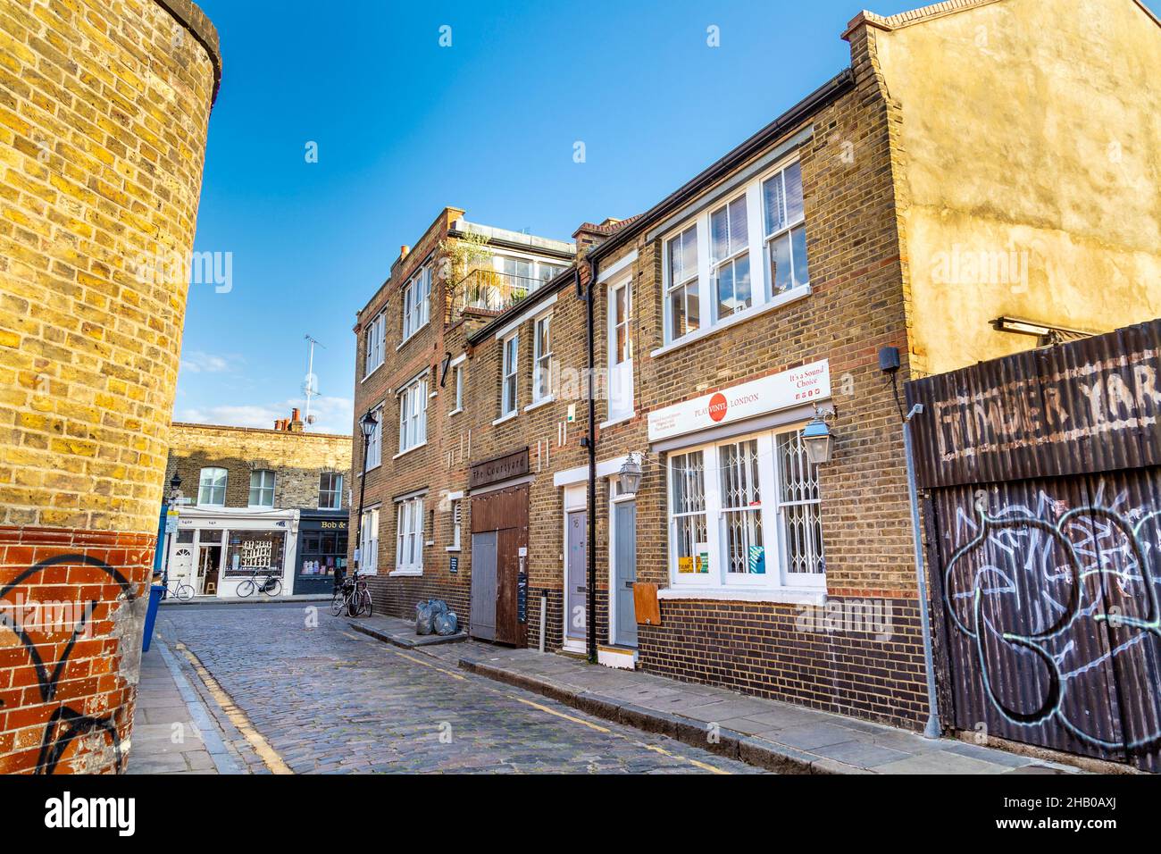 Cobblestone paved Ezra Street in Bethnal Green, London, UK Stock Photo