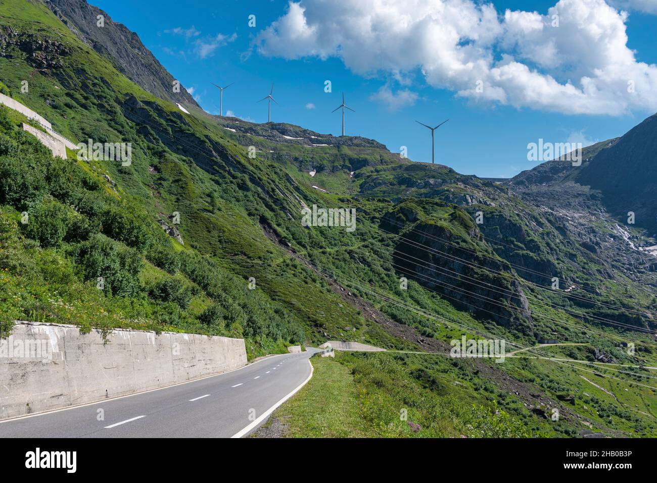 Wind turbine above the Nufenen Pass road near the Nufenen Pass, Ulrichen, Valais, Switzerland, Europe Stock Photo