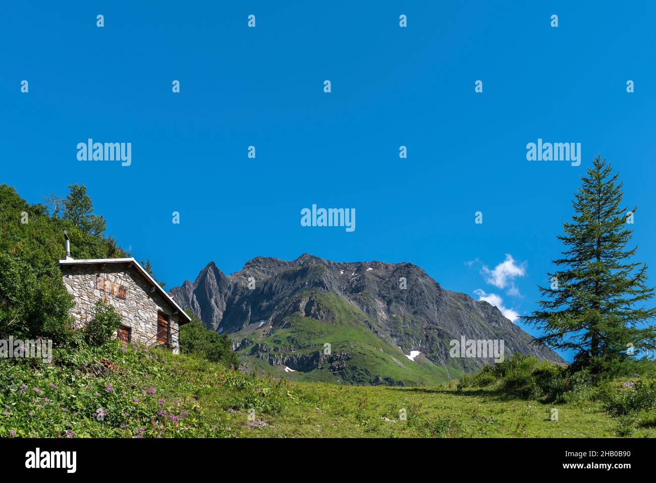 Mountain hut in alpine landscape near the hamlet of Ladstafel below the Nufenen Pass, Ulrichen, Valais, Switzerland, Europe Stock Photo
