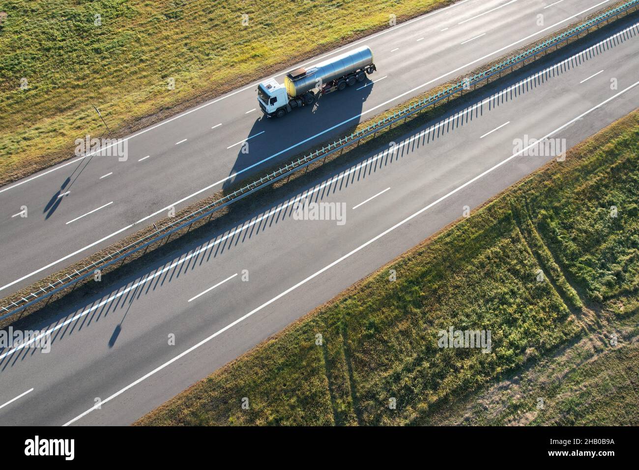 Vehicle with cistern on highway delivery of chemical products Stock Photo