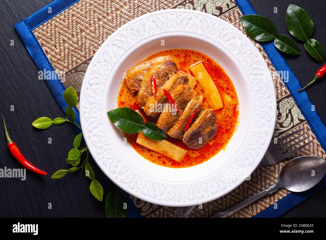 Thai food concept Thai coconut milk red curry duck in white ceramic