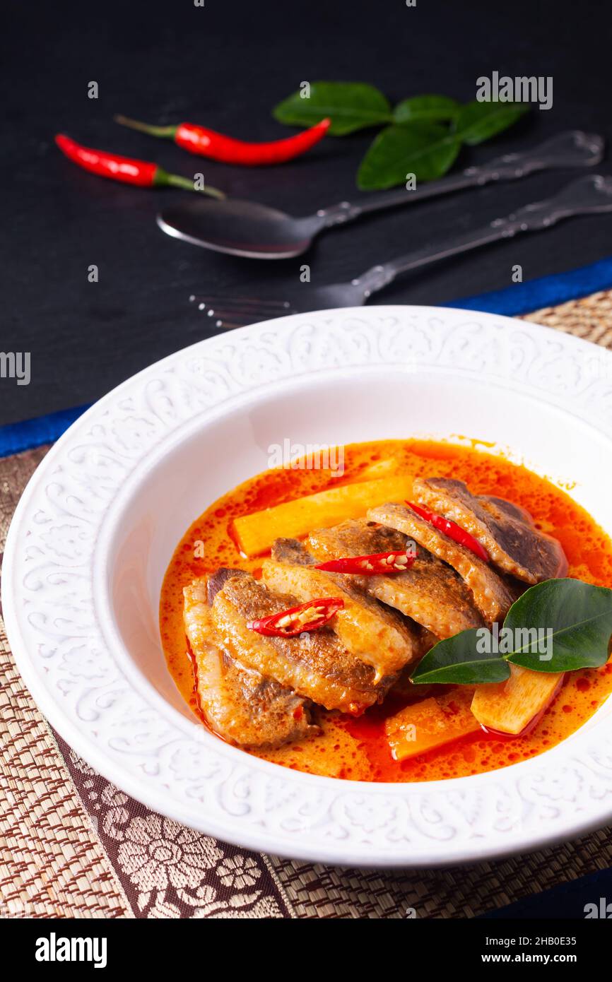 Thai food concept Thai coconut milk red curry duck in white ceramic
