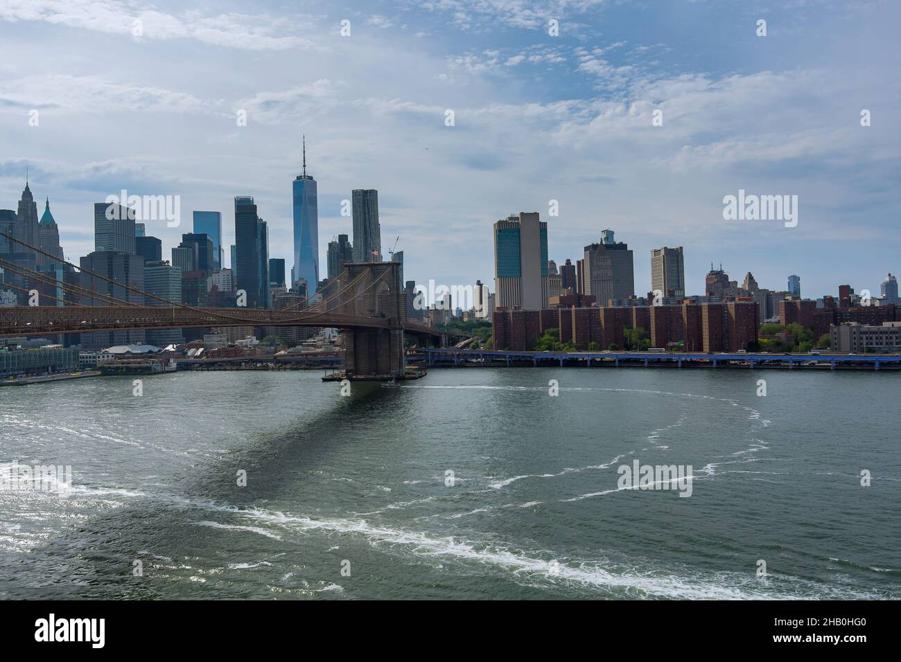 Brooklyn Bridge over East River view lower Manhattan waterfront New York City Stock Photo