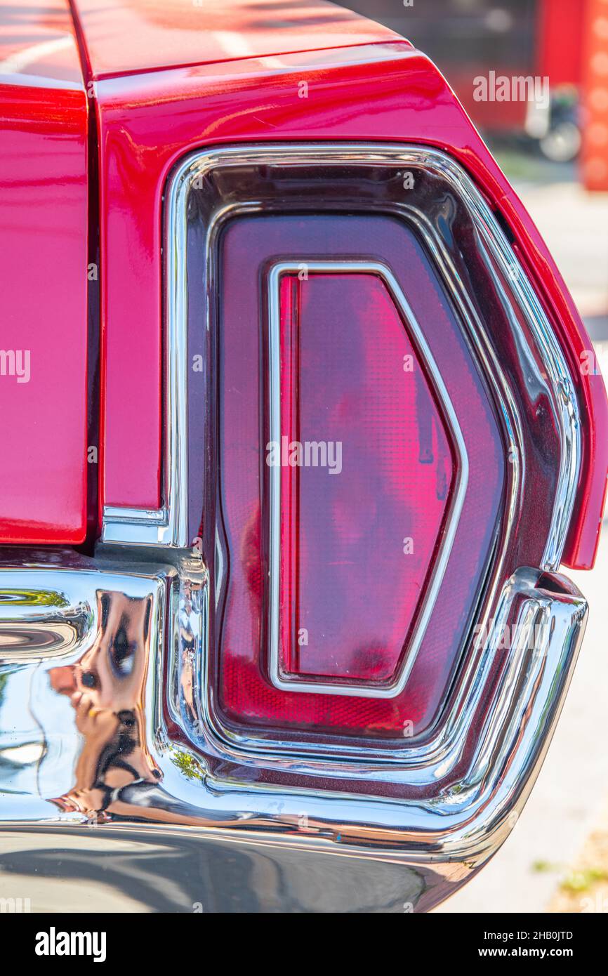 The red brake light or taillight of a red classic car or Muscle Car Stock Photo Alamy