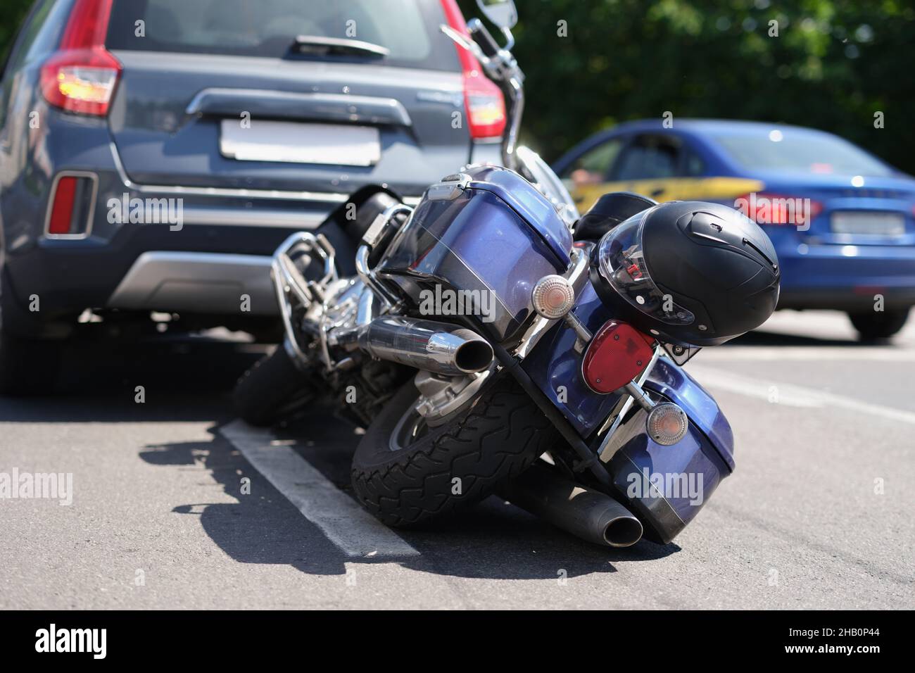 Traffic accident between electric bicycle and car, motorbike fell on