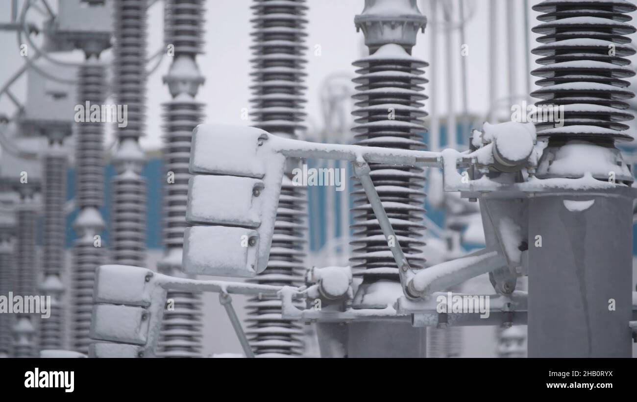 Switchgears and switches in a power plant with steel structure. Power plant detail, high voltage isolation. Voltage transformers at the power plant. Stock Photo