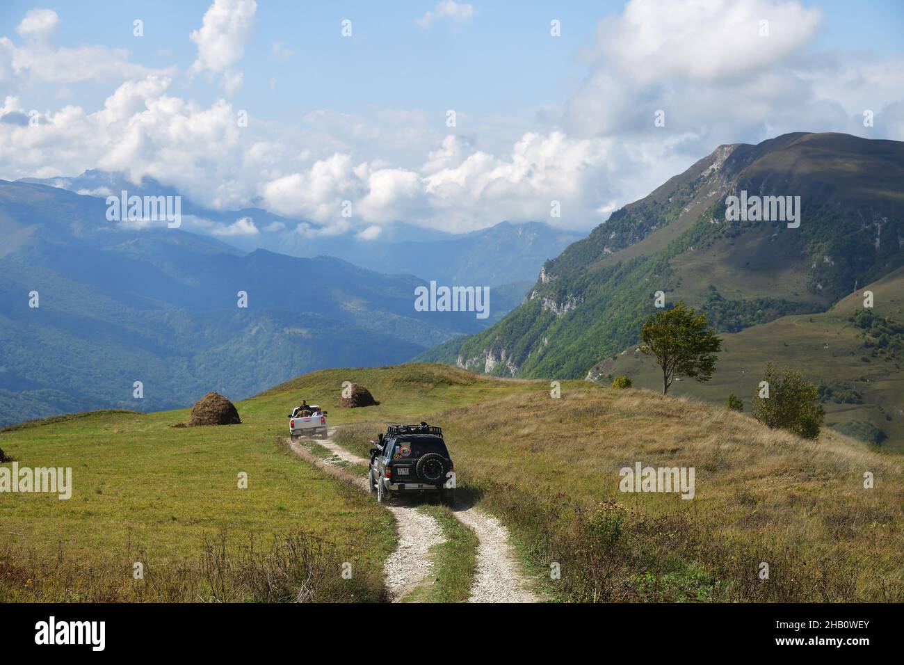 Chechnya, Russia - Sept 12, 2021: Off-road cars shown in the Caucasus mountains. Vedeno district of the Chechen Republic. Extreme mountain safari is o Stock Photo