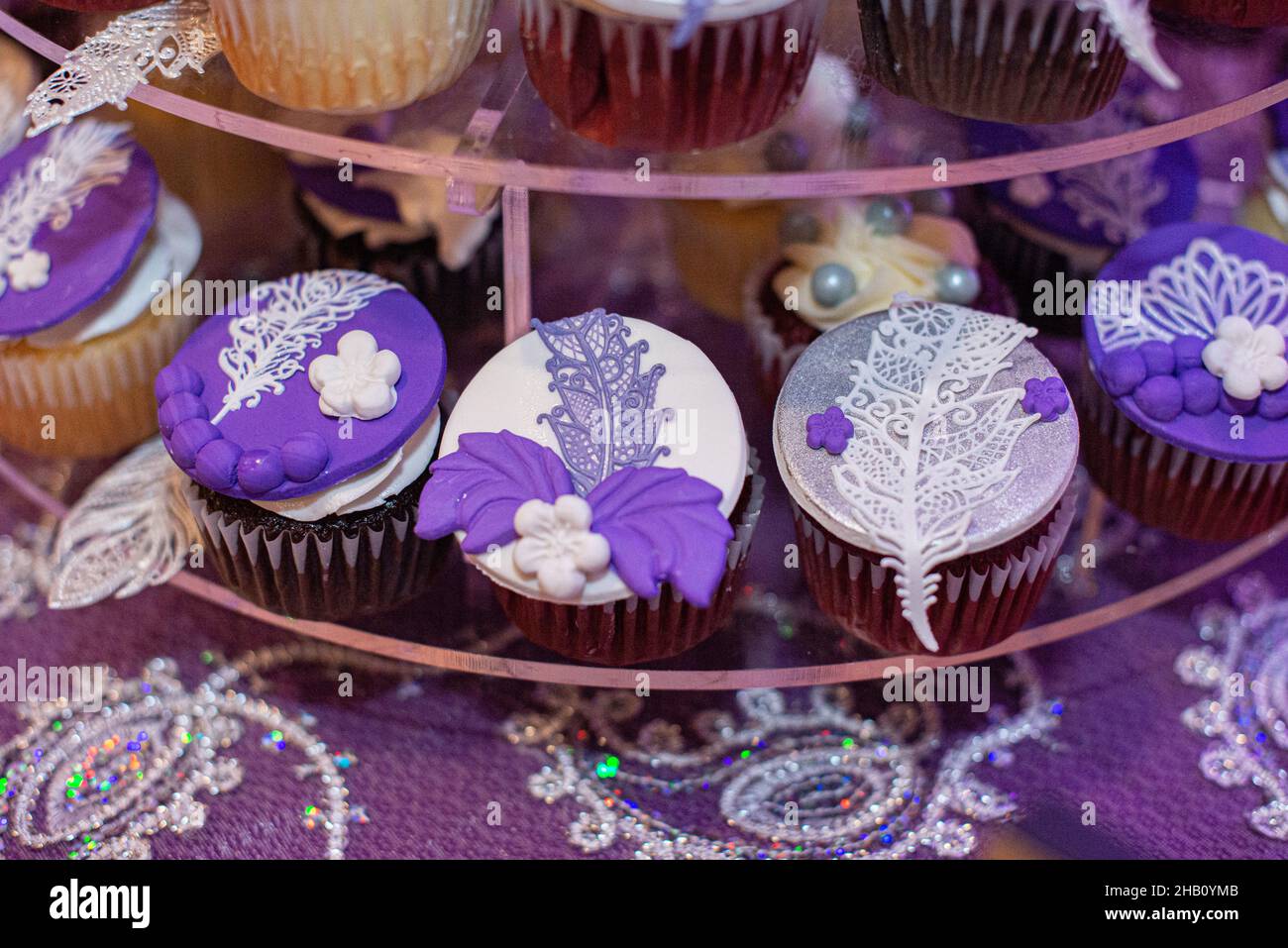 Purple Great Gatsby themmed cup cakes at wedding Stock Photo Alamy