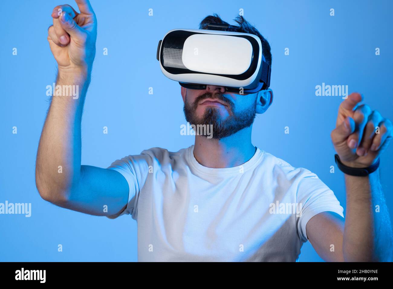 Young man designer or architector having virtual reality experience using vr headset. Stock Photo