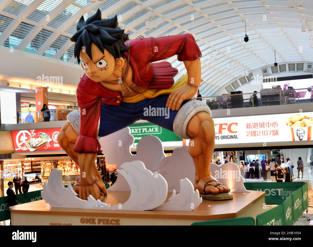 On podium inside a shopping arcade displays an inflatable figure of Luffy, the protagonist of Japanese manga One Piece Stock Photo