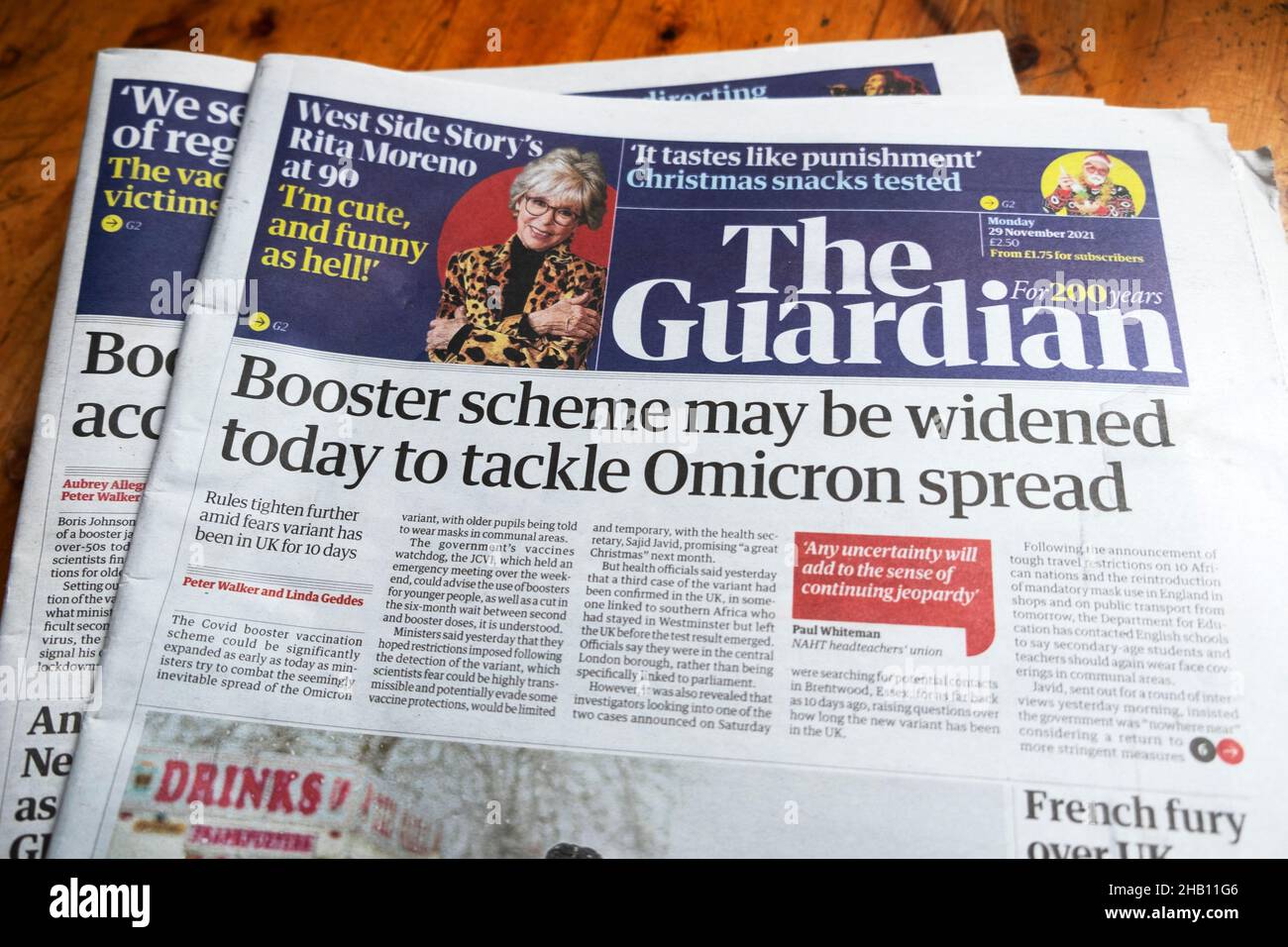 "Booster scheme may be widened today to tackle Omicron spread"  Guardian covid newspaper headline front page on 29 September 2021 in London England UK Stock Photo