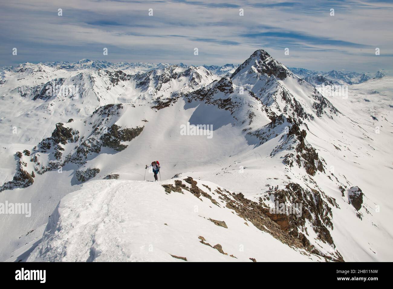 Last climb to the top of the mountain in winter Stock Photo