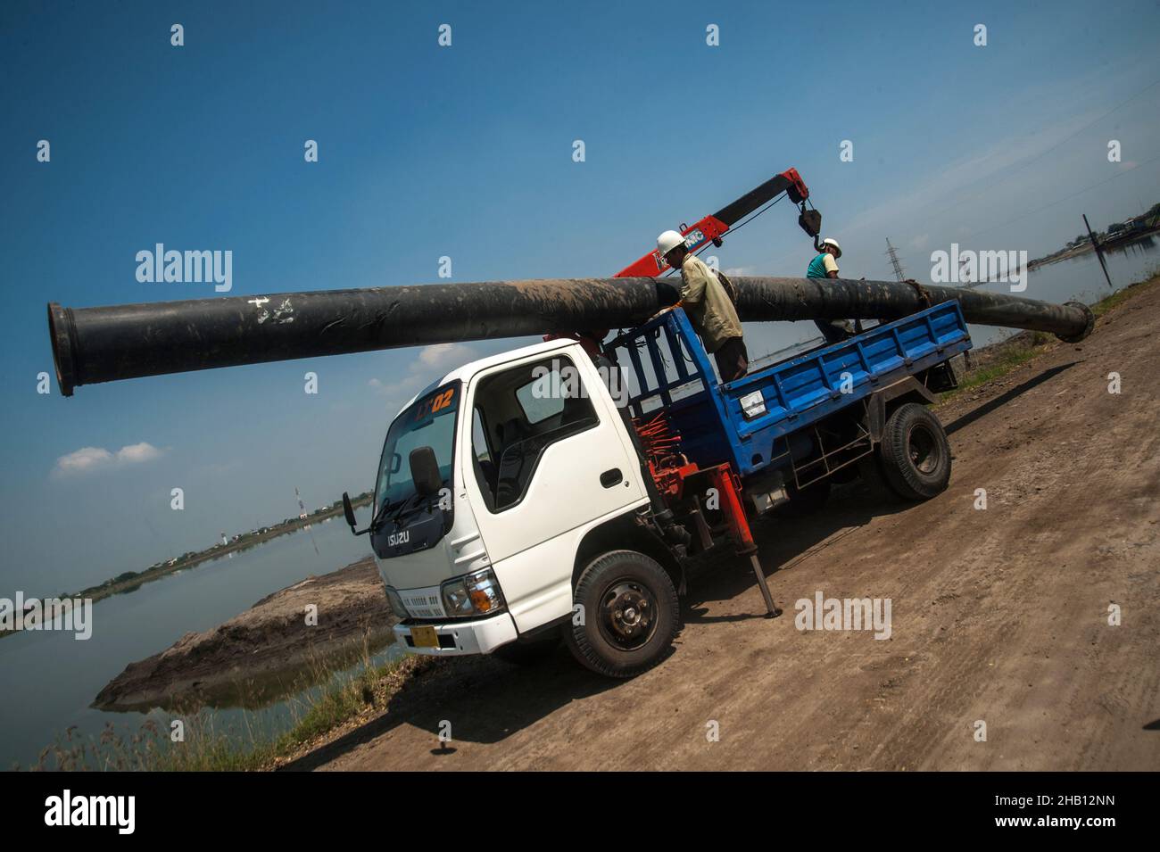 Photo dated October 19, 2016 - Workers activities seen carrying the big pipe at the Lapindo volcanic mudflow disaster area in Sidoarjo, East Java province, Indonesia. Since May 29, 2006 until now, as 1,143.3 hectares area land has changes be the natural territory of the world's largest mud volcano were belches water, oil, methane gas and mud everytime. The geological activity is a contributor to methane gas emissions amount as the largest natural gas manifestation on earth, based on the study report published in the journal Scientific Reports on February 18, 2021. Photo by Sutanta Aditya/ABACA Stock Photo