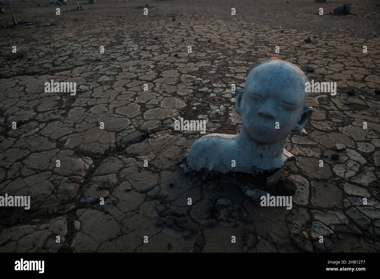 Photo dated October 19, 2016 - The cymbol of public protests statue against the disaster handling seen amid the Lapindo volcanic mudflow spreads ways in Sidoarjo, East Java province, Indonesia. Since May 29, 2006 until now, as 1,143.3 hectares area land has changes be the natural territory of the world's largest mud volcano were belches water, oil, methane gas and mud everytime. The geological activity is a contributor to methane gas emissions amount as the largest natural gas manifestation on earth, based on the study report published in the journal Scientific Reports on February 18, 2021. Ph Stock Photo