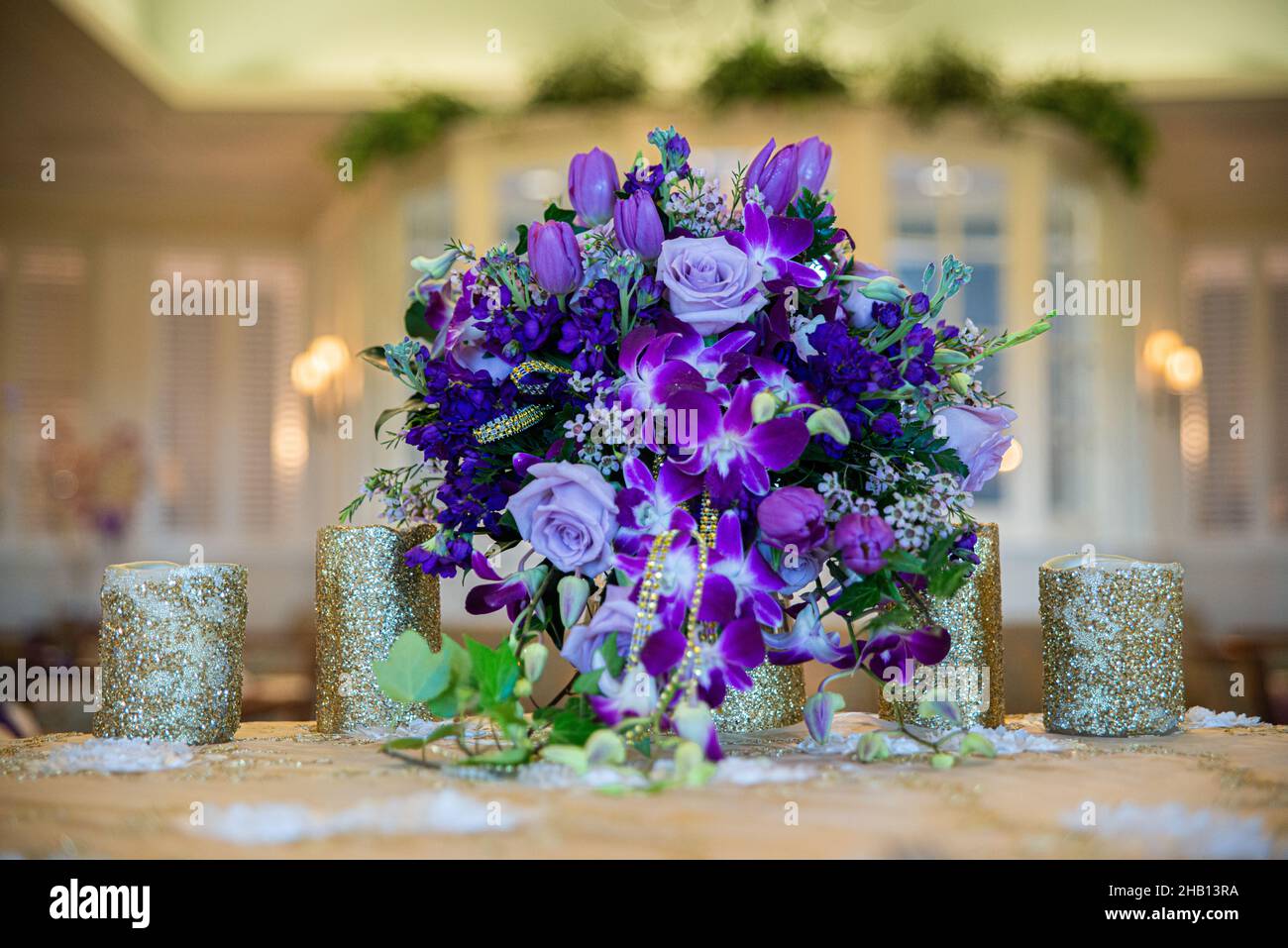 Purple rose and flowers bouquet table centerpiece on wedding reception  sweetheart table Stock Photo - Alamy, image size:1300x957