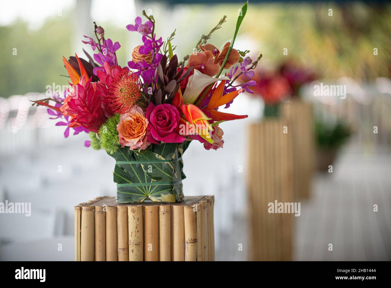 Colorful flower bouquet on bamboo stand at wedding ceremony Stock Photo
