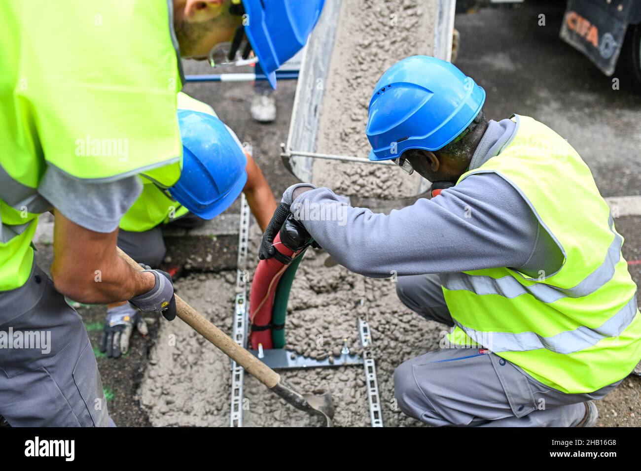 Bron, on 2021/07/08 (central-eastern France): first low-carbon urban construction site with a fully electric compact excavator and a hybrid truck mixe Stock Photo