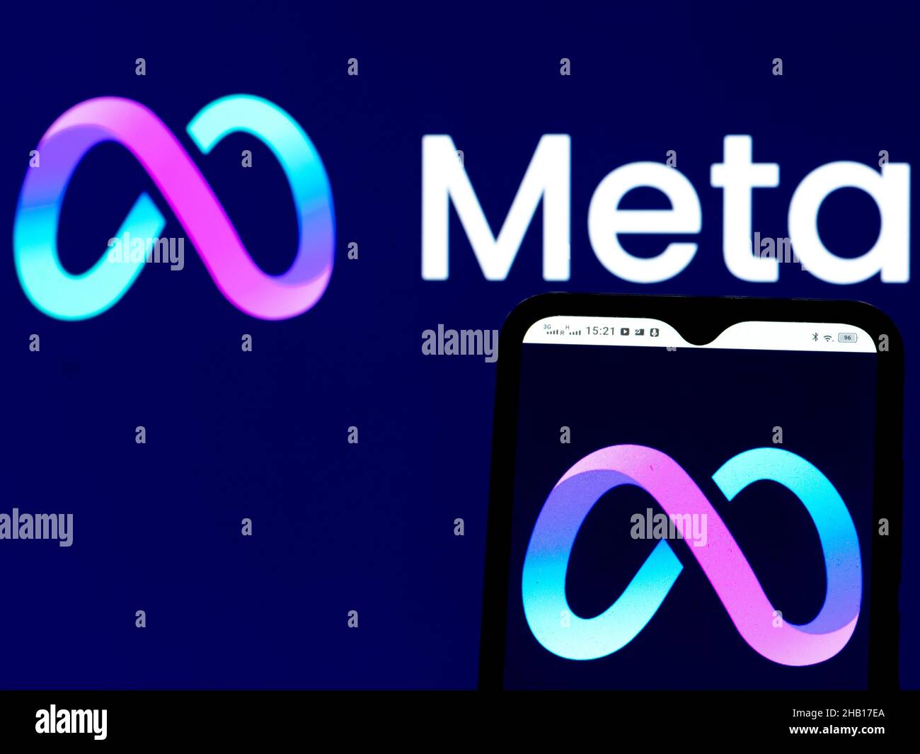 In this photo illustration a Meta Platforms Inc. logo seen displayed on a smartphone and in the