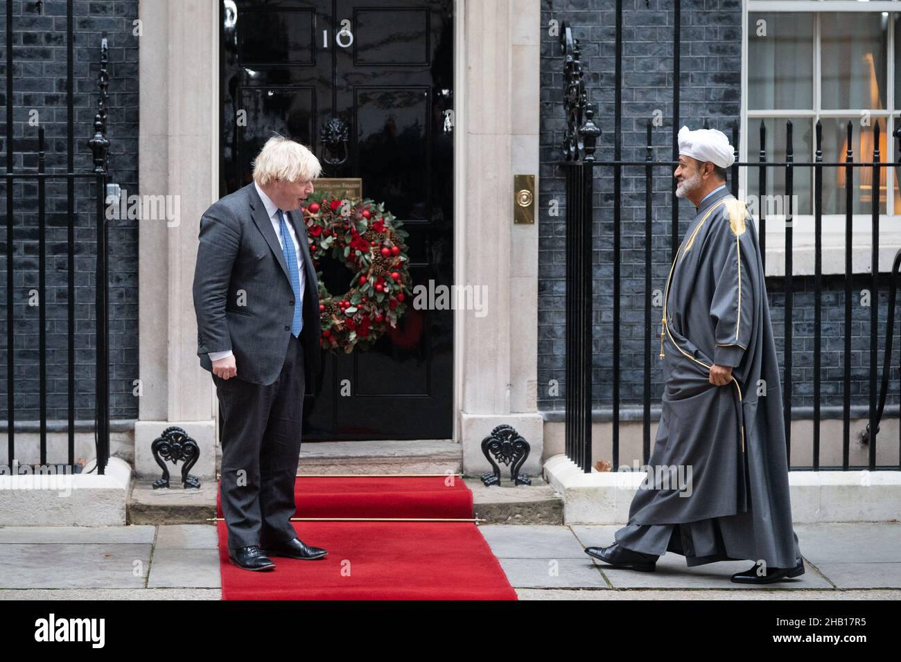 Prime Minister Boris Johnson greets the Sultan of Oman Haitham Bin Tarik Al Said outside 10 Downing Street, central London. Picture date: Thursday December 16, 2021. Stock Photo