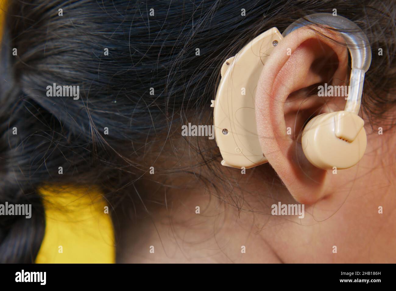 Hearing aid concept, a kid with hearing problems. Stock Photo