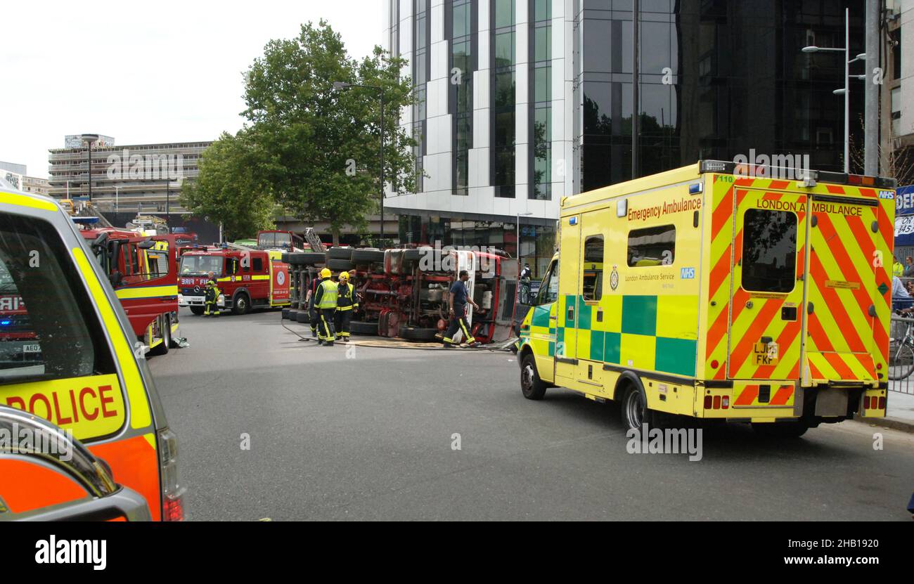 Emergency Services On Scene at a Road Traffic Accident in Central London Involving an Overturned Truck Stock Photo