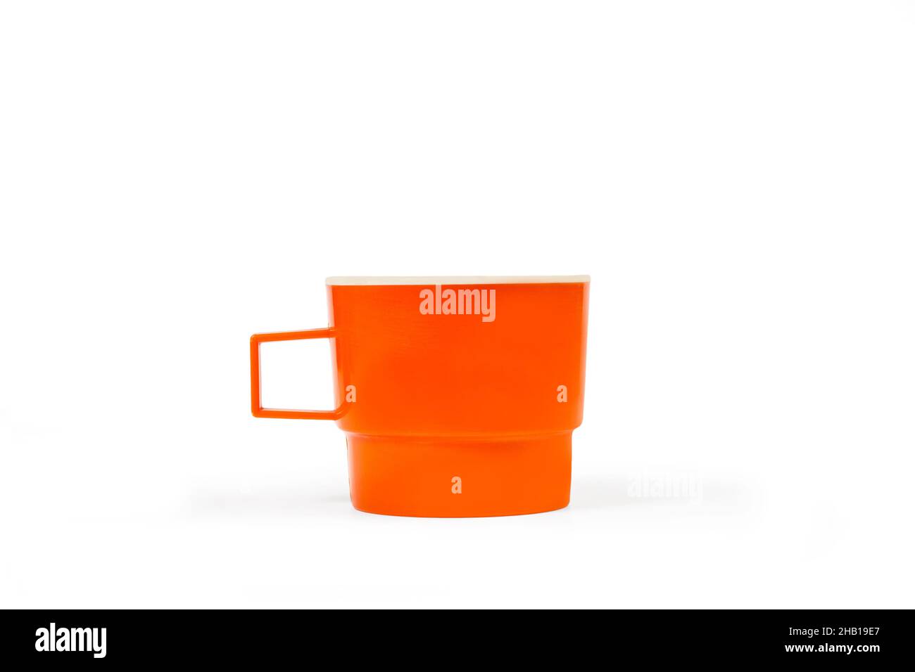 Orange mug isolated on a white background with copy space Stock Photo