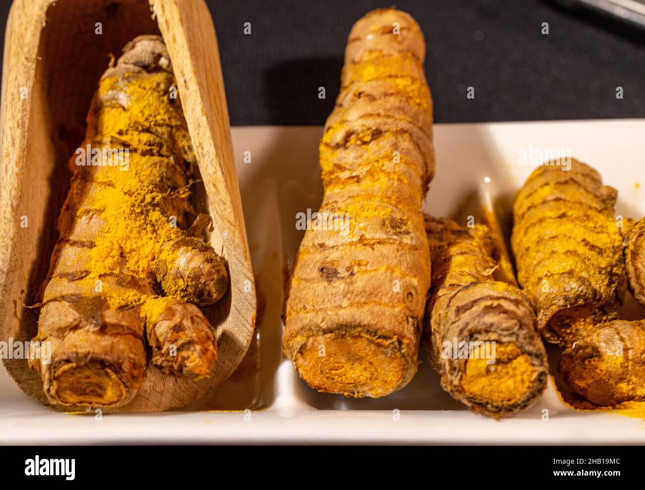 Ginger Roots on a dark background Stock Photo