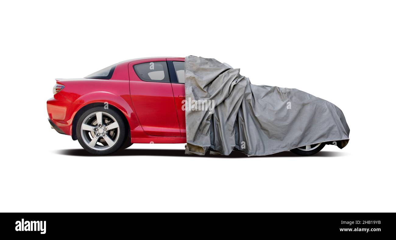Half covered car isolated on white background Stock Photo
