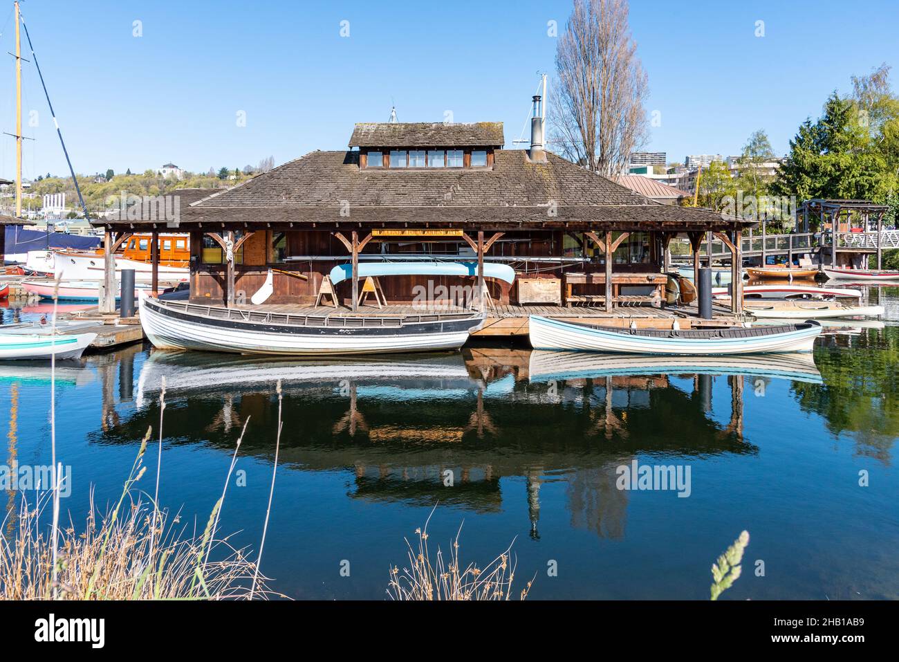 Harbor with small boats reflected in the water Stock Photo - Alamy