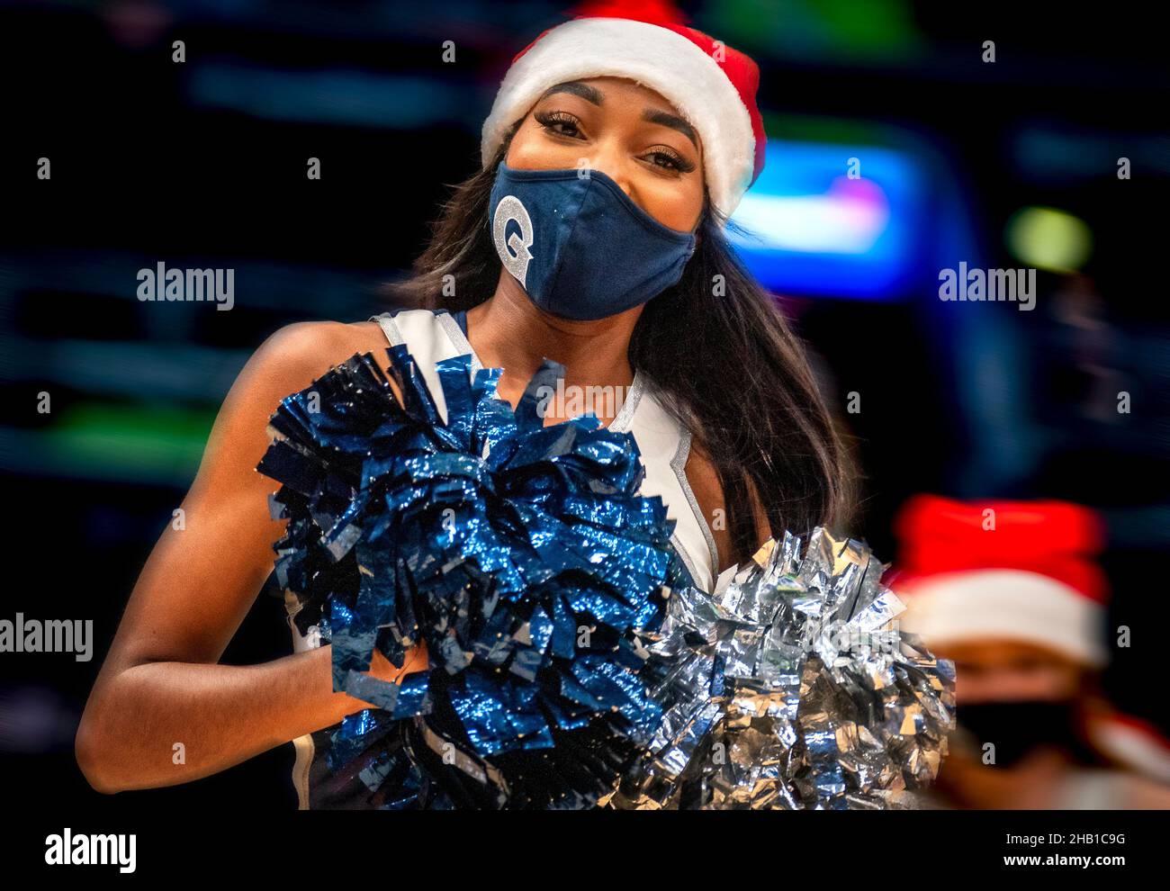 WASHINGTON, DC - DECEMBER 15:  Georgetown Hoyas cheerleader in a Christmas motif during a college basketball game between the Georgetown Hoyas and the Stock Photo
