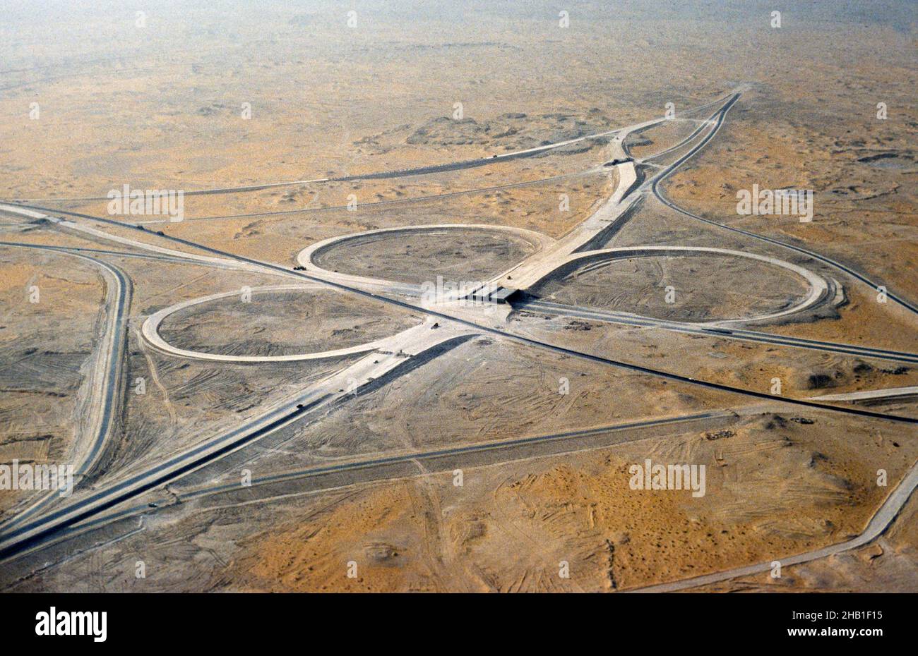 Motorway road junction infrastructure development Dhahran, Saudi Arabia being built in desert, 1979 Stock Photo