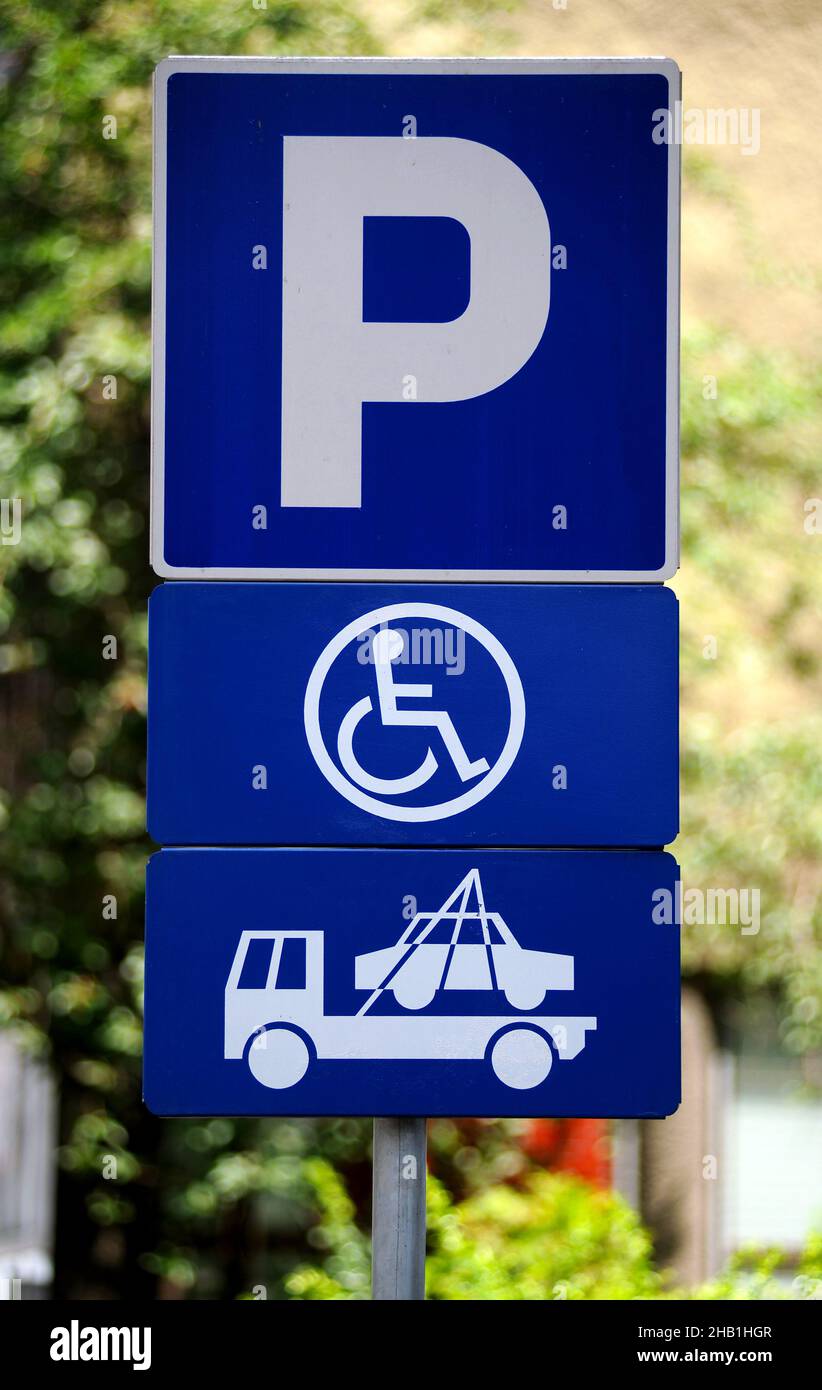 vehicle removal service in case of taking the disabled parking space sign close up photo Stock Photo
