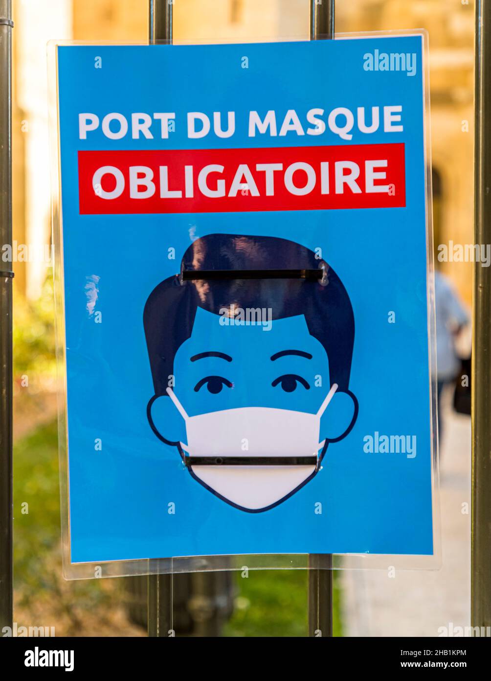 Sign in French states that wearing a mouth-nose covering is mandatory Stock Photo