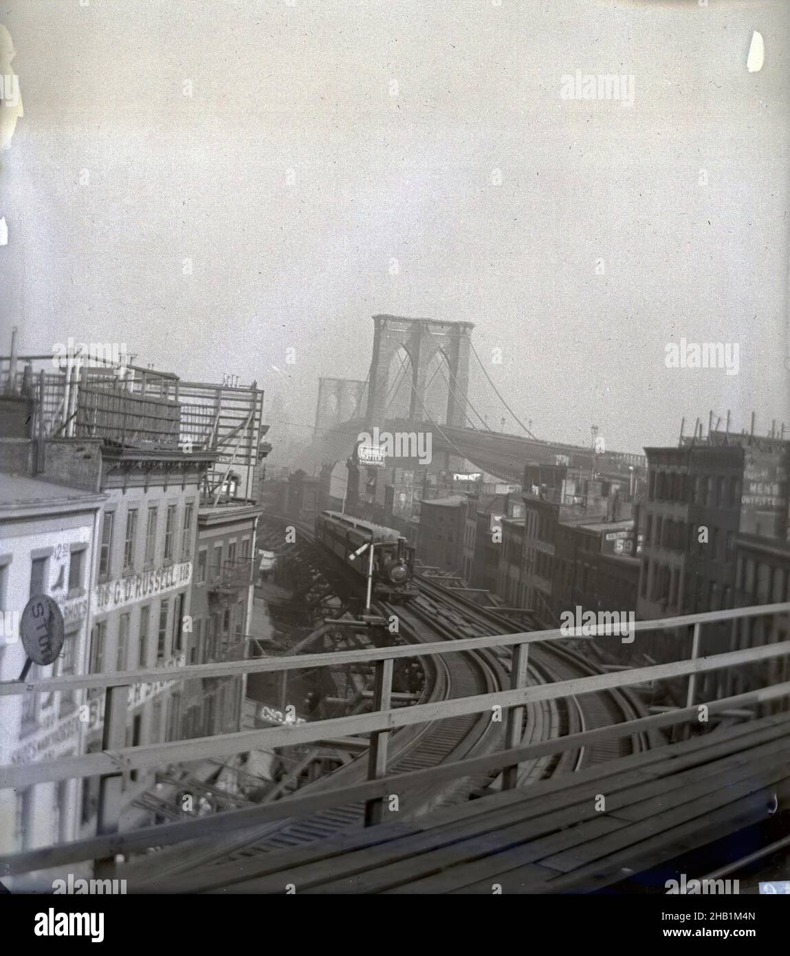 Brooklyn Bridge and Elevated Road to Fulton Ferry, Edgar S. Thomson, American, active 1890s-1900s, Glass plate negative, 1896, 4 x 5 in., 10.2 x 12.7 cm, architecture, archival photograph, Brooklyn Bridge, Brooklyn history, civil engineering, documentary photography, early photojournalism, East River, elevated, landmark, New York City, old Brooklyn, old New York, rails, subway, suspension bridge, tower, tracks, transportation Stock Photo
