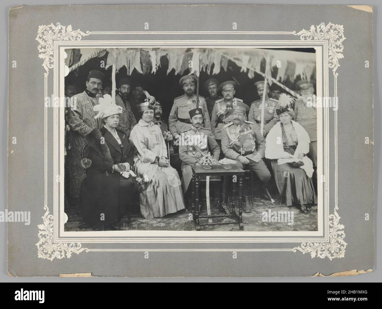 General Yanushkevich and the Russian Consul at a Garden Party given by the Persian Crown Prince at Tabriz, One of 274 Vintage Photographs, Gelatin silver printing out paper, 1916, Qajar, Qajar Period, photo: 6 5/8 x 9 1/8 in., 16.8 x 23.2 cm;, Azerbaijan, black and white, garden party, General Yanushkevich, hat, Iran, military, Persia, photo, Russia, uniform Stock Photo