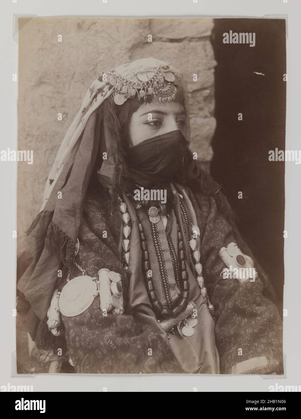 Portrait of Female Member of Shah's Family, One of 274 Vintage Photographs, Albumen silver photograph, late 19th-early 20th century, Qajar, Qajar Period, 8 1/8 x 6 1/8 in., 20.7 x 15.6 cm, 19th century, girl, half veil, historical fashion, Iran, mask, Middle East, niqaab, Persia, photograph, portrait, princess, Shah, tribal costume, veil Stock Photo